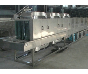 Integrated machine for basket washing, box washing and drying